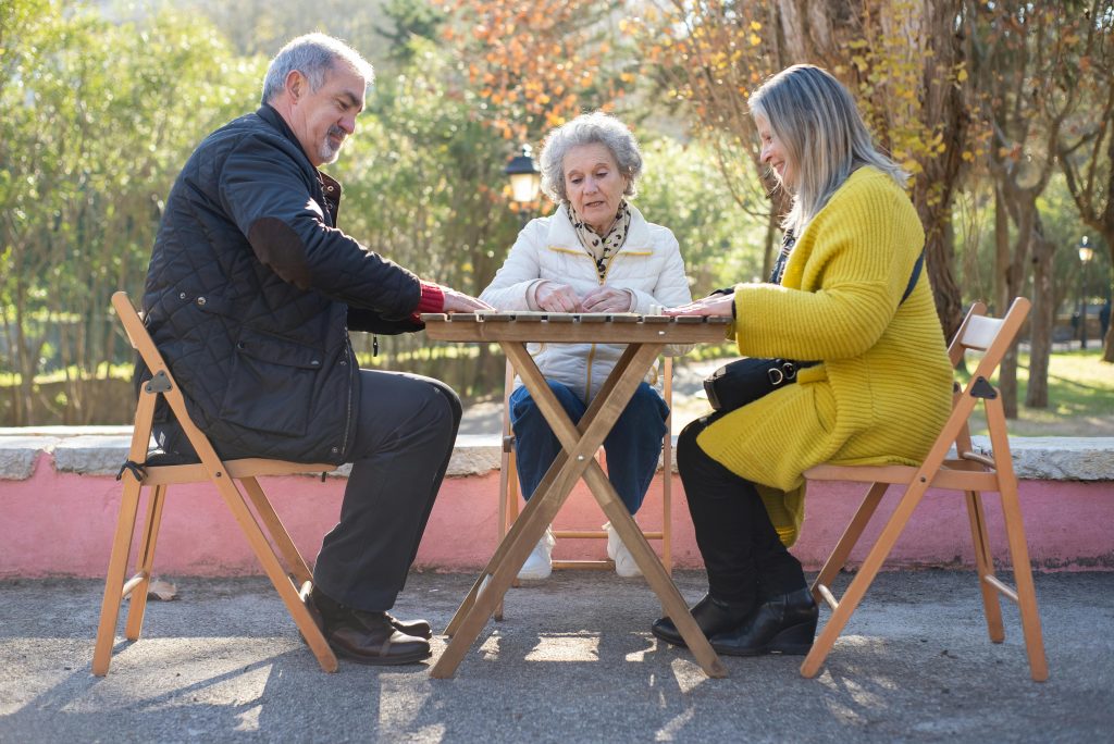 three people sitting at a table